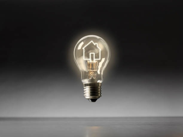 istock Electric Lightbulb with a Illminated House Filament 532378767