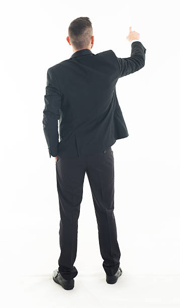 istock Back View of a Businessman Pushing the Button 532378797