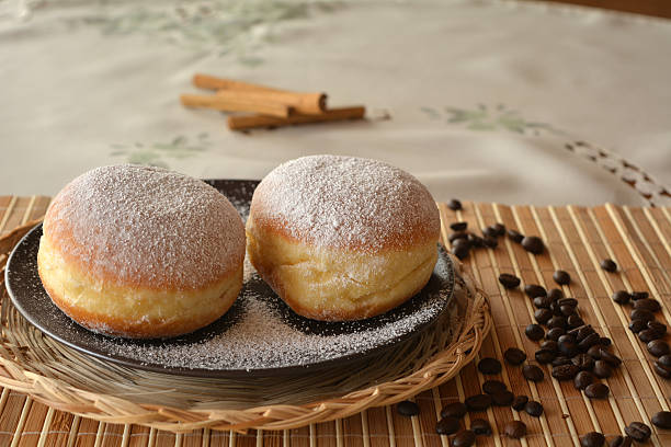 istock Donuts with powdered sugar on the brown plate 532379223