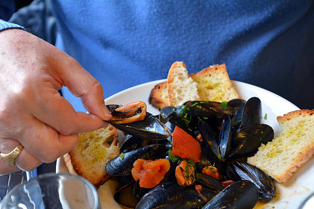 istock Steamed mussels on a white bowl 532384516