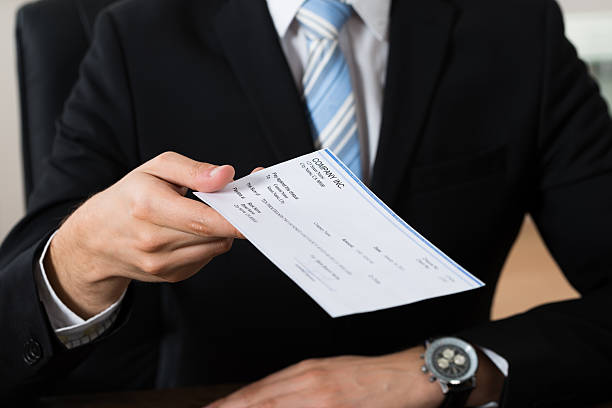 istock Businessman Giving Cheque 532384944