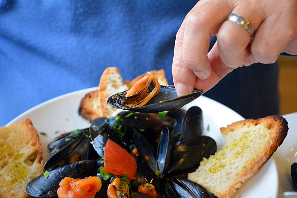 istock Steamed mussels on a white bowl 532386810