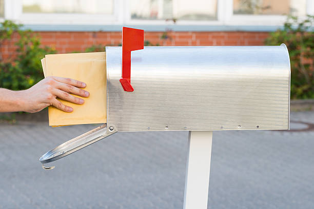 istock Person Putting Letters In Mailbox 532387322