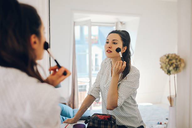 istock Young Parisian woman putting make up on 532389936