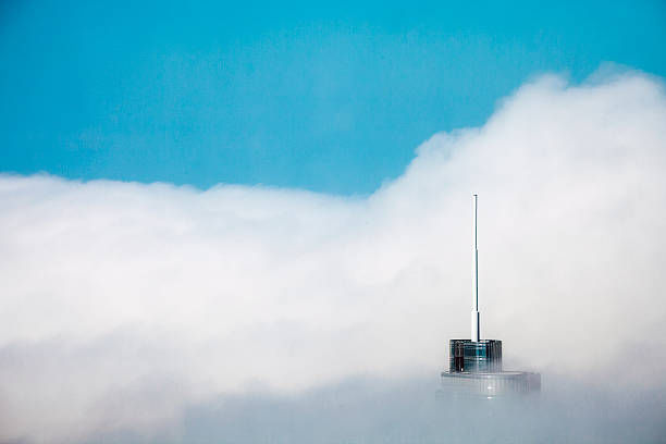 Chicago highrise building surrounded by clouds.