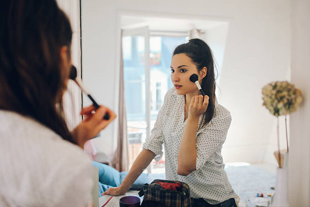 istock Young Parisian woman putting make up on 532390086