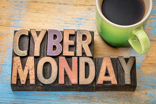 Cyber Monday in wood type Cyber Monday - internet holiday shopping - text in vintage letterpress wood type with a cup of coffee printing block photos stock pictures, royalty-free photos & images
