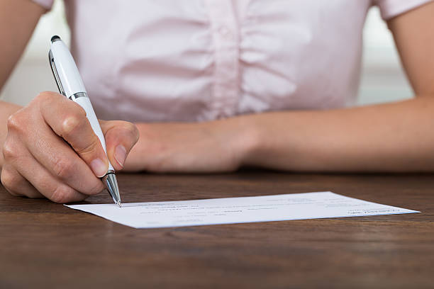 istock Person Hands Signing Cheque 532390800