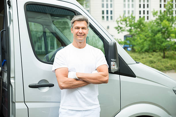 istock Painter With Arms Crossed In Front Of Van 532392158