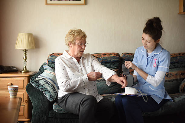 istock home visit blood pressure health check 532393639