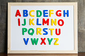 Magnet plastic alphabet on whiteboard