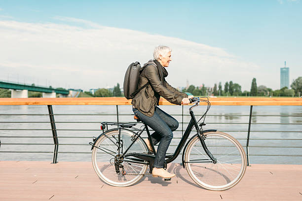 istock Mature Woman Riding Bicycle. 532395398