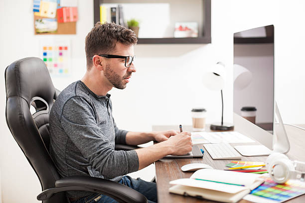istock Graphic designer in a trendy workplace 532395416