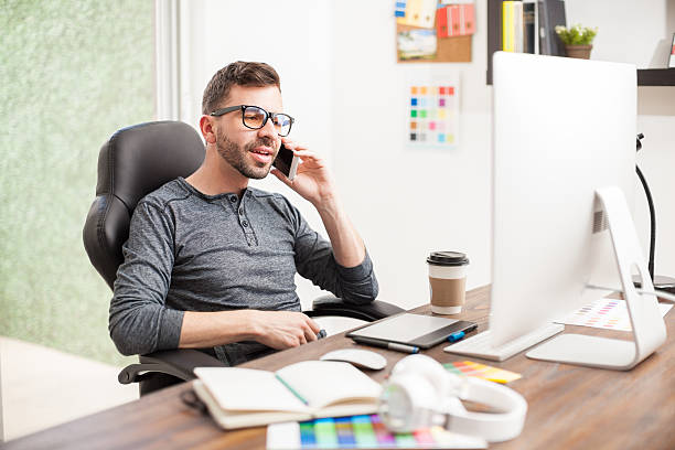 istock Nerdy designer talking over the phone 532395794