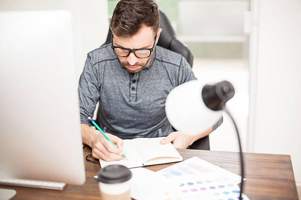 istock Using pen and paper to draw a sketch 532396210