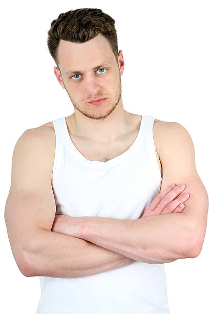 istock muscular man with arms crossed isolated on white 532396308