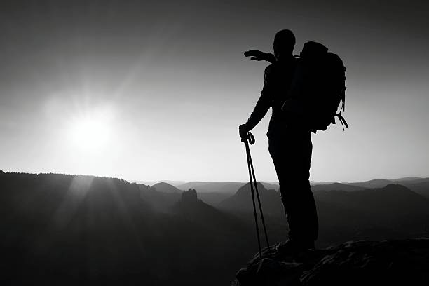 istock Sharp silhouette,  top of mountain with sun in the frame. 532396720