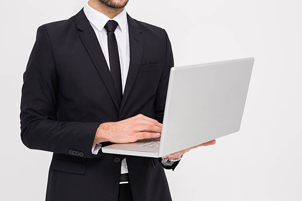 istock Mid section of a businessman using laptop 532399475