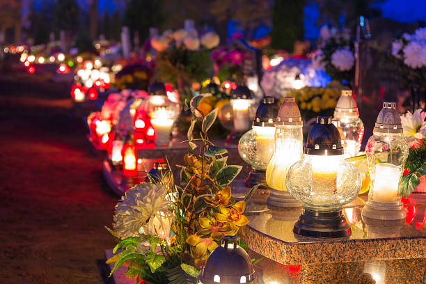 istock Cemetary at night with colorful candles for All Saints Day 532400529