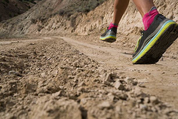 istock Woman Running on Dirt Road 532401696