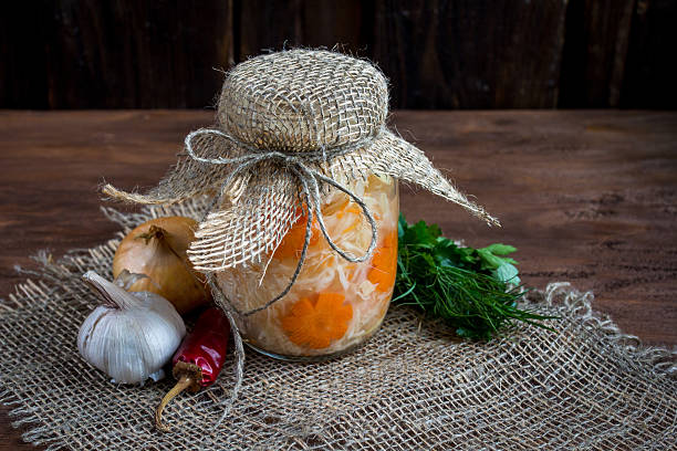 istock Sauerkraut with carrot in a glass jar 532403112