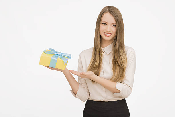 istock Young woman portrait holding gift 532404026