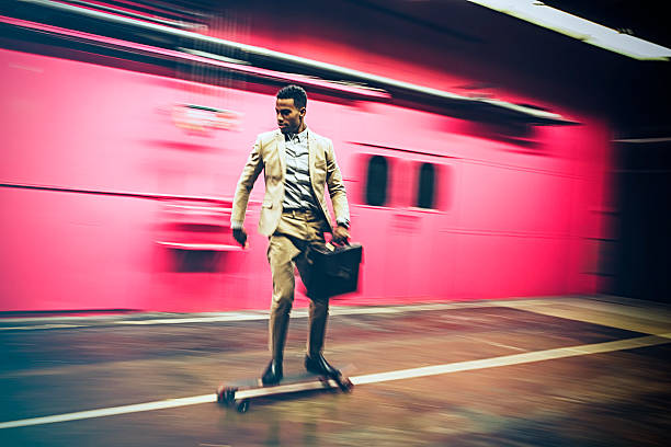 istock businessman in hurry on longboard 532404836