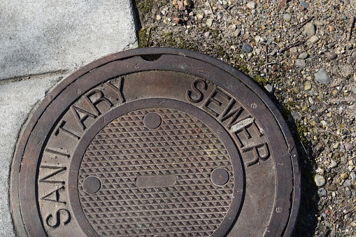 Top view close up of a Sanitary Sewer lid