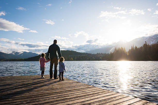 Father and daughter connection Father and daughters bonding by the lake british columbia photos stock pictures, royalty-free photos & images