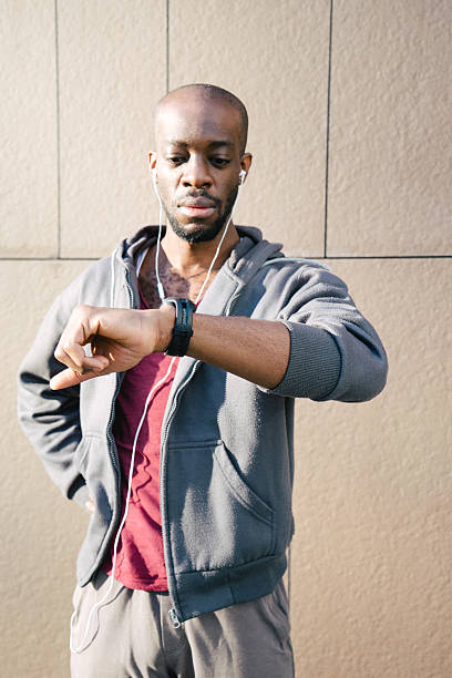 istock Young Sport Man Looking At His Smart Watch 532406372