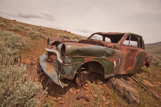 istock Old abandoned car with bullet holes 532407220