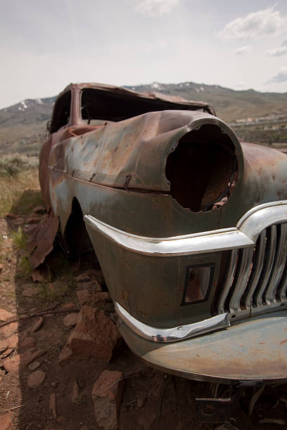 istock Old abandoned car with bullet holes 532407238