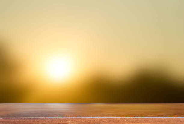 istock Wooden board with Blurred of Gold light on sun set. 532408514