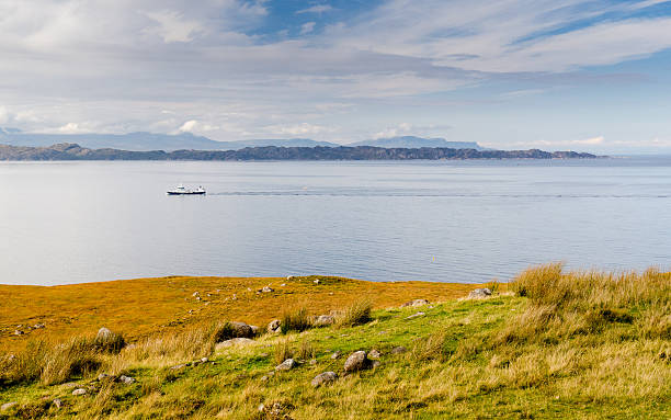 Fishing boat in the Minch A fishing boat passes through the Minch between the Isle of Skye and Applecross Peninsula in the Highlands of Scotland. applecross peninsula stock pictures, royalty-free photos & images