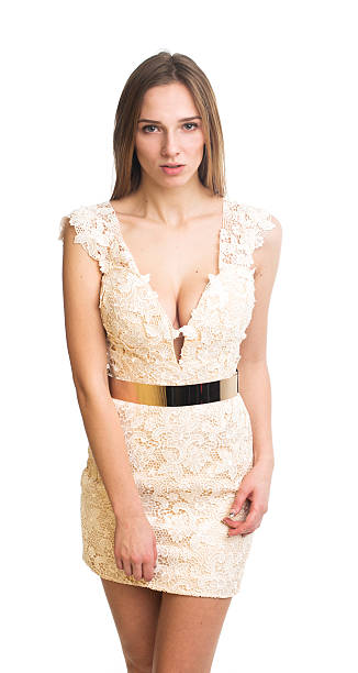 istock Pretty young woman in white dress posing in studio 532411045