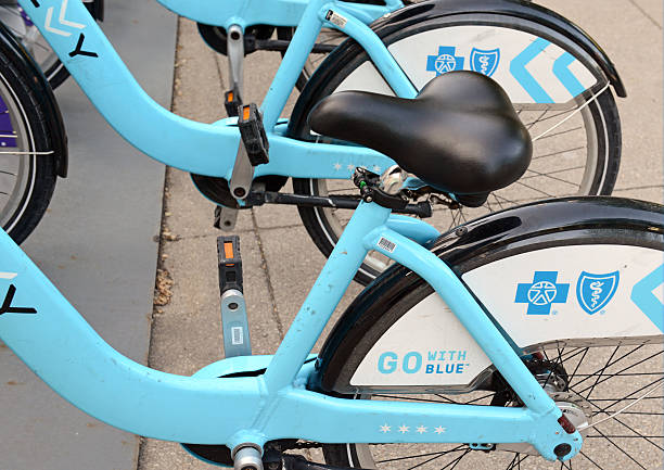Divvy Bike share, Chicago Chicago, USA - May 19, 2016: Divvy, a Bicycle share program in Chicago gives residents and tourists one more transportation option and reduces the consumption of fossil fuels. chicago smog stock pictures, royalty-free photos & images