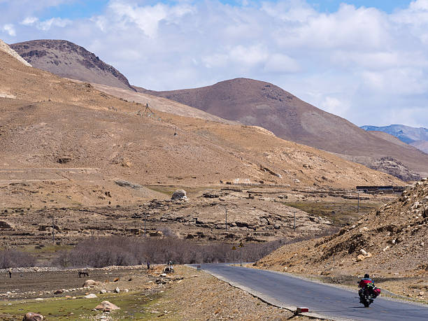 istock Man ride motorcycle along the road 532413692