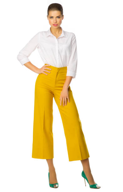 istock Young woman in yellow pants 532414508