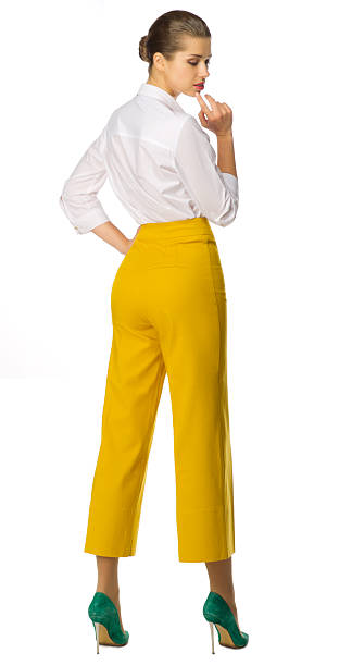 istock Young woman in yellow pants 532414542
