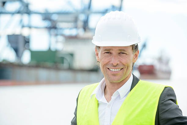 istock Professional man in hard hat at shipping docks 532416749