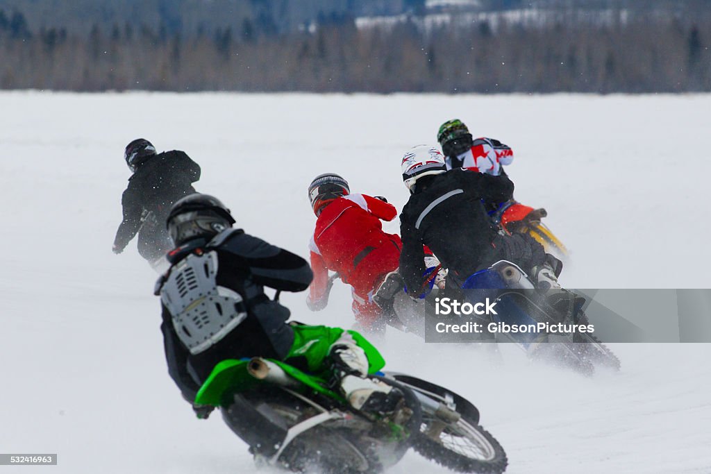 Motorcycle Ice Race A group of men compete in a winter motorcycle ice race. Motorcycle Stock Photo