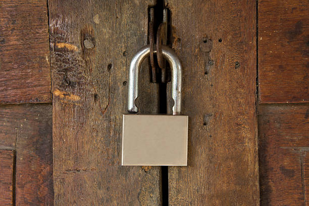 istock padlock on a wooden door 532417347