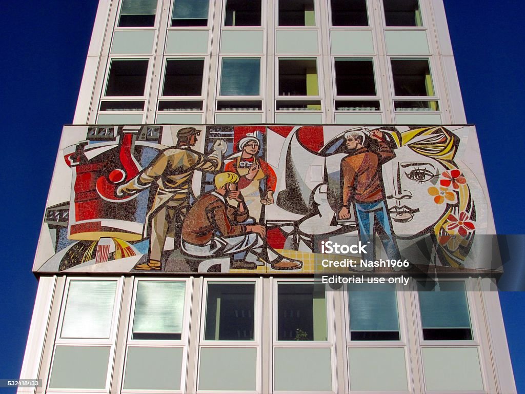 Socialist art in Berlin Berlin, Germany - march 8, 2011: The mosaic called 'Unser Leben' (Our lives) from socialist artist Walter Womacka (1925-2010). This work of art was created in 1968 and attached to the outside of an office building called "House of the teacher" on the south-east corner of Alexanderplatz in Berlin. The mosaic covers an area of no less than  7 X 125 metres. Socialism Stock Photo