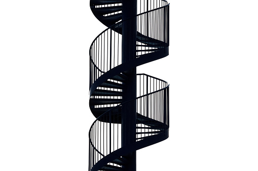 An empty spiral metal staircase on white background