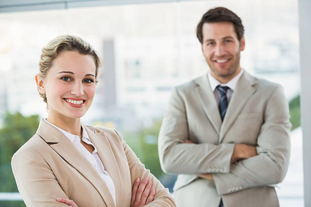 istock Business people posing with arms crossed smiling at camera 532445035