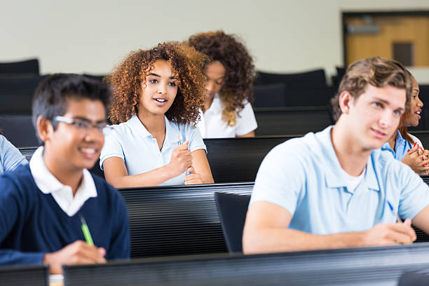 istock Students listening to professor in private college prep school 532445463