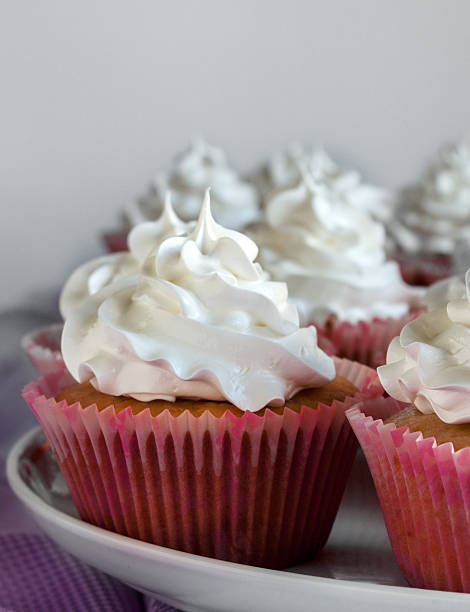 istock sweet cupcakes with cream 532445591