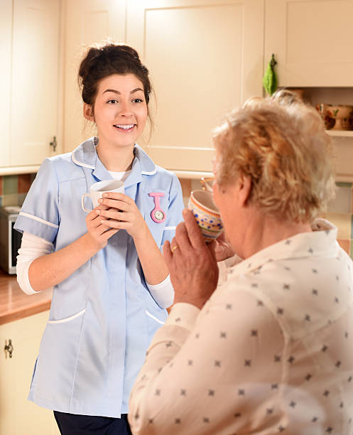 istock senior woman chats to care worker 532446517