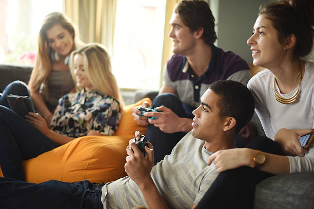 istock teenagers playing video games 532446645