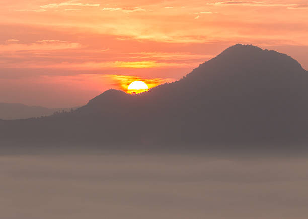 Sunrise at behind of mountain stock photo